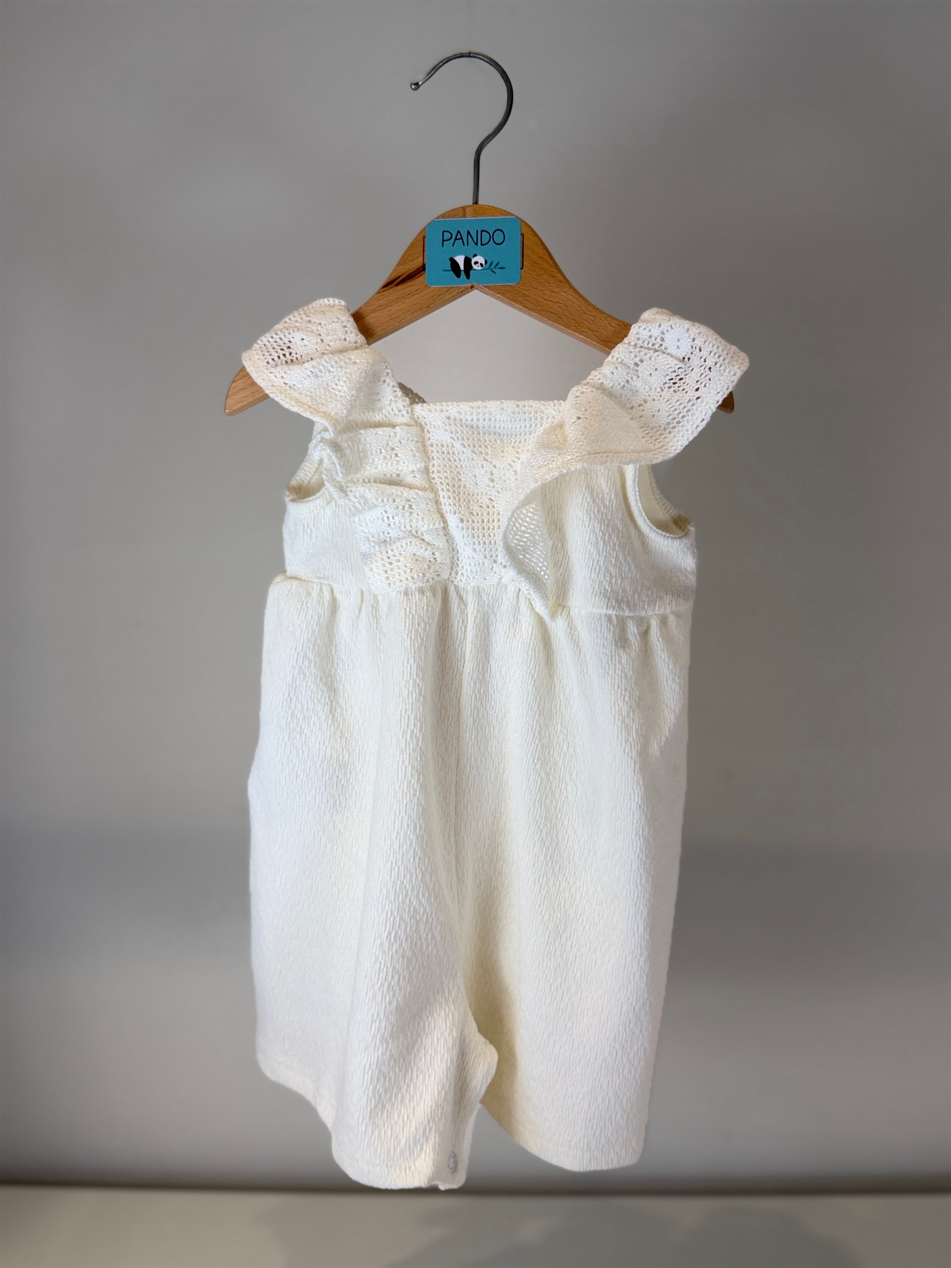 Tutina Neonata con Volant in Maglia “Pure Elegance”