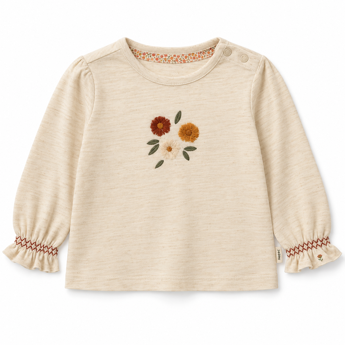 Maglia panna con fiori ricamati e polsini a volant